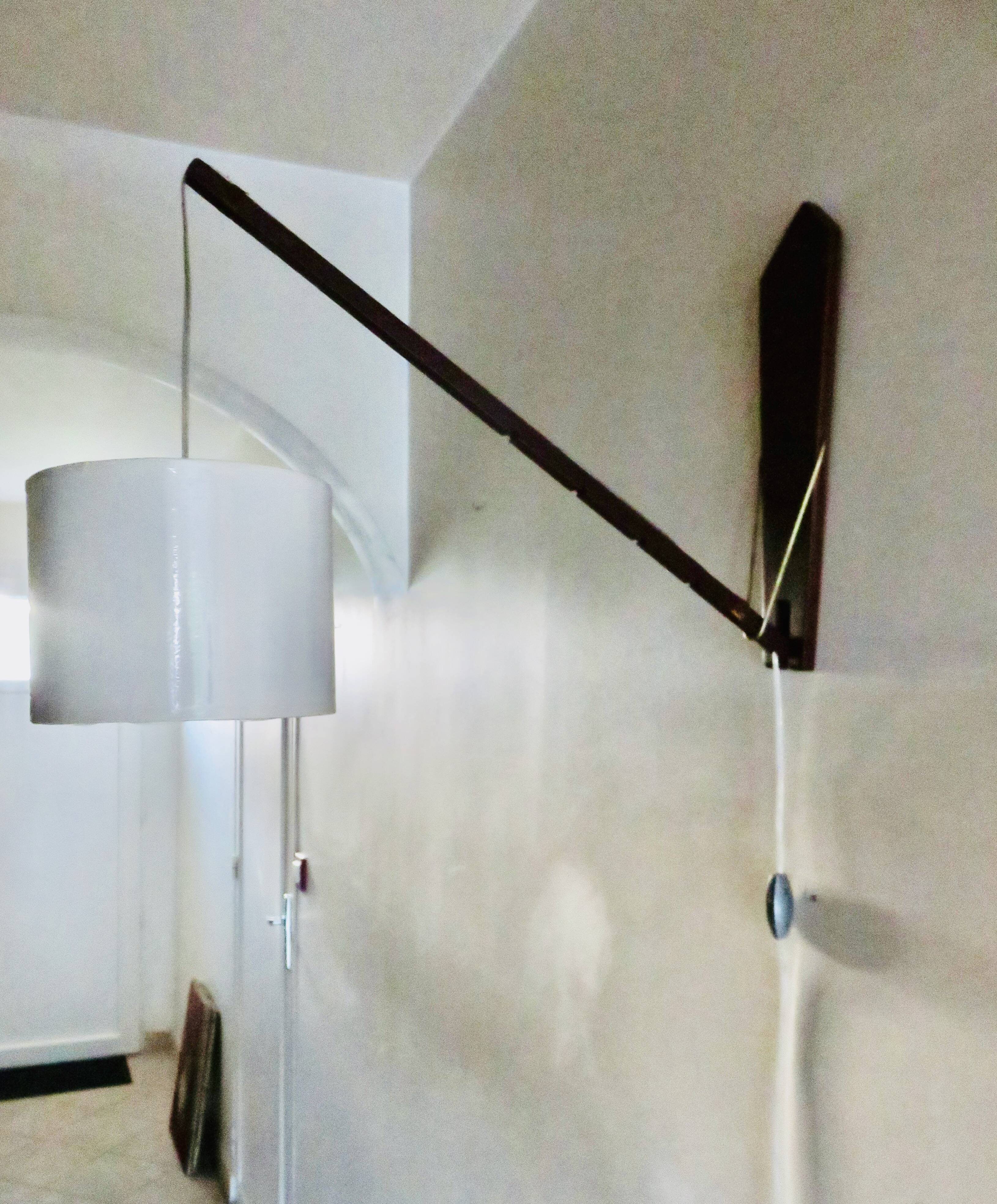 Teak wall light with articulated arm. Denmark 1960