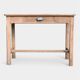Art Deco farmhouse table made of raw wood.