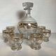 Antique liqueur set with a gold rim.