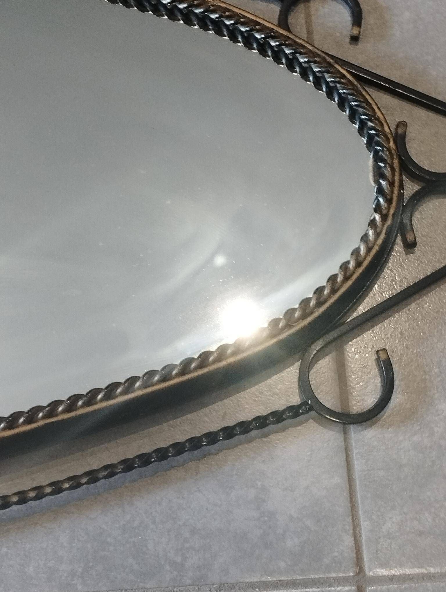 Mid-century modern iron mirror, brutalist, vintage organic, thick sixties.