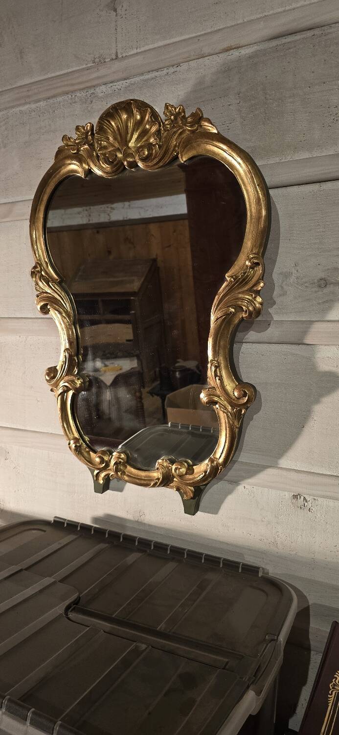 Golden wood mirror.