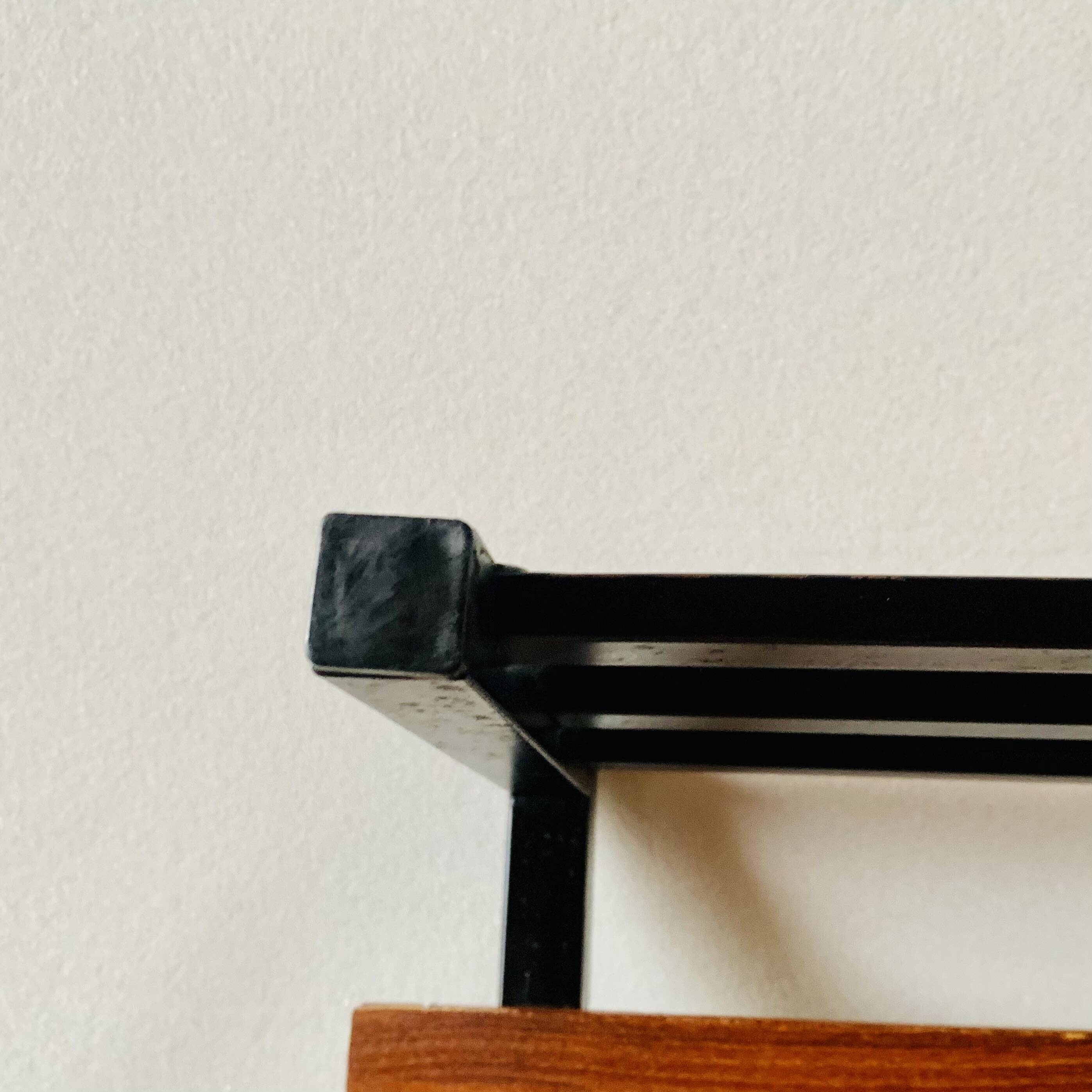 Vintage wall-mounted coat rack in wood and black metal