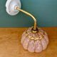 Vintage glass wall light with a pink and gold Clichy globe.