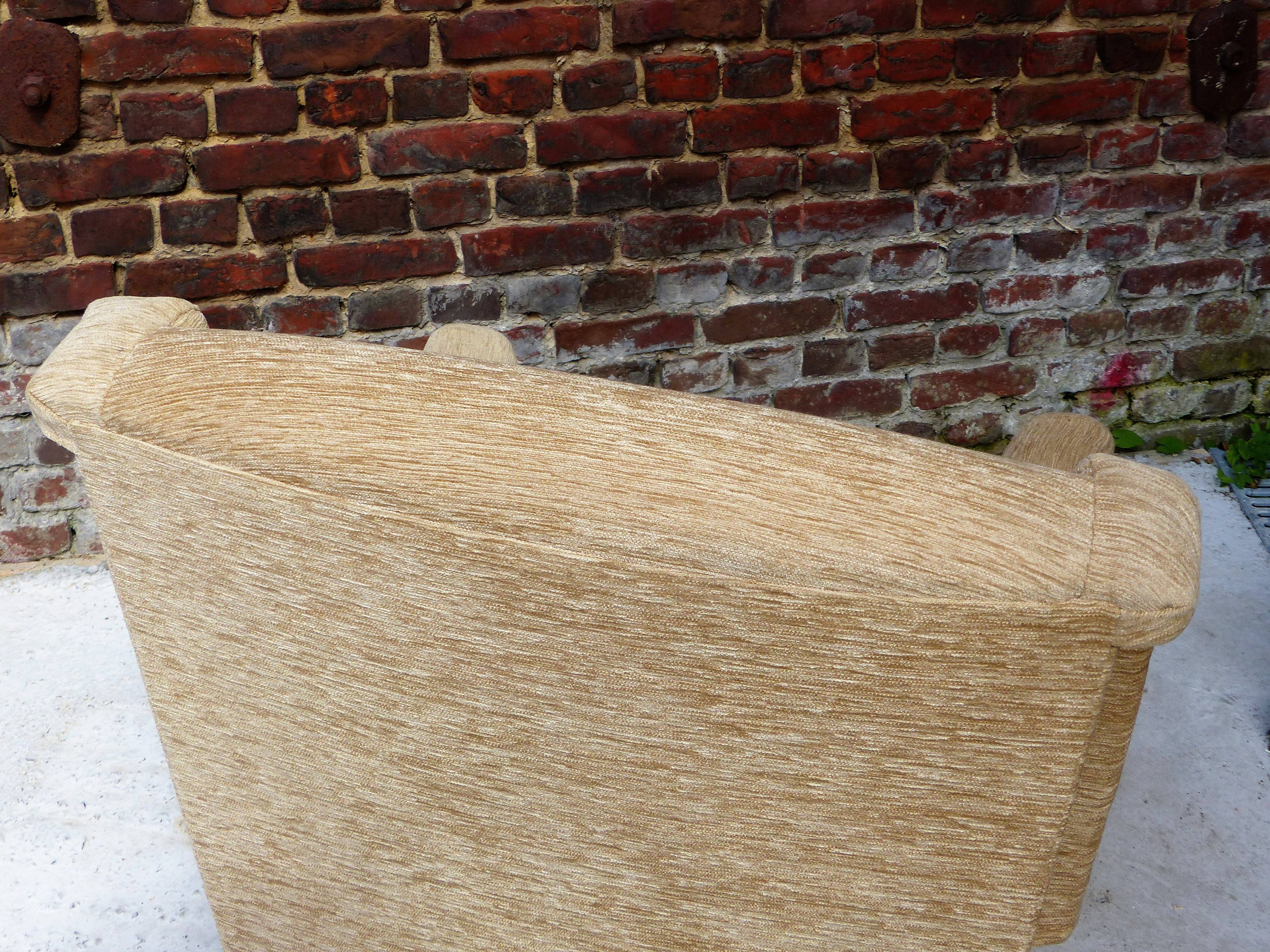 Fauteuil en velour beige et franges