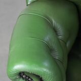 Large green cowhide Chesterfield office chair in English style on wheels