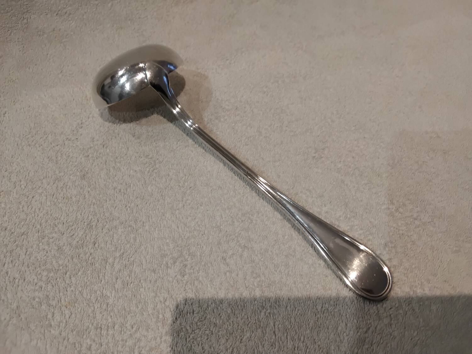 Silver-plated metal soup ladle by Christofle silversmiths, Albi pattern