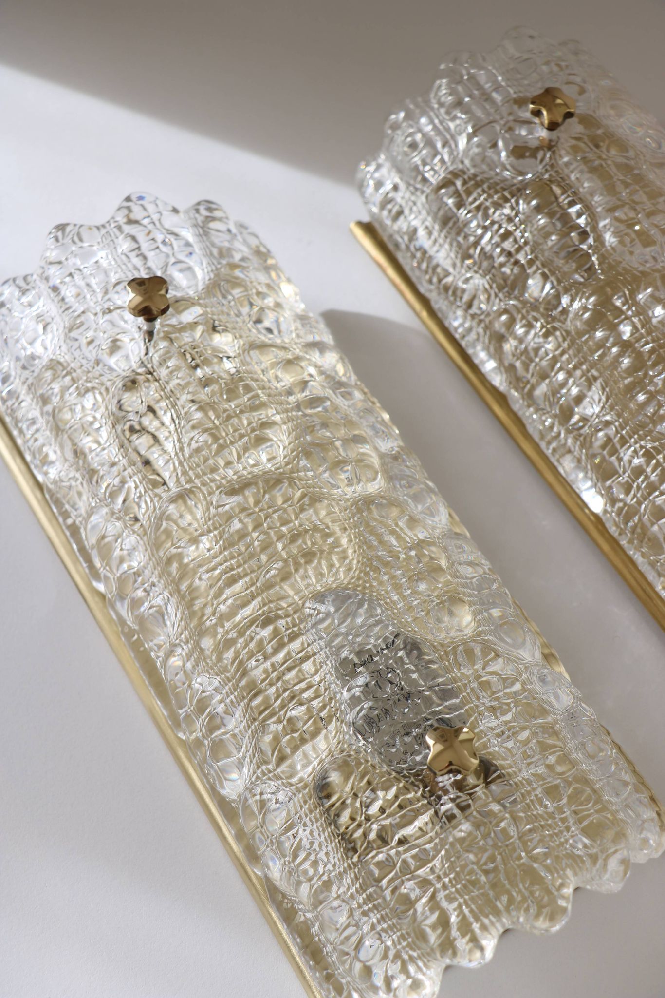 Pair of glass and brass wall lights by Carl Fagerlund for Orrefors, 1960.
