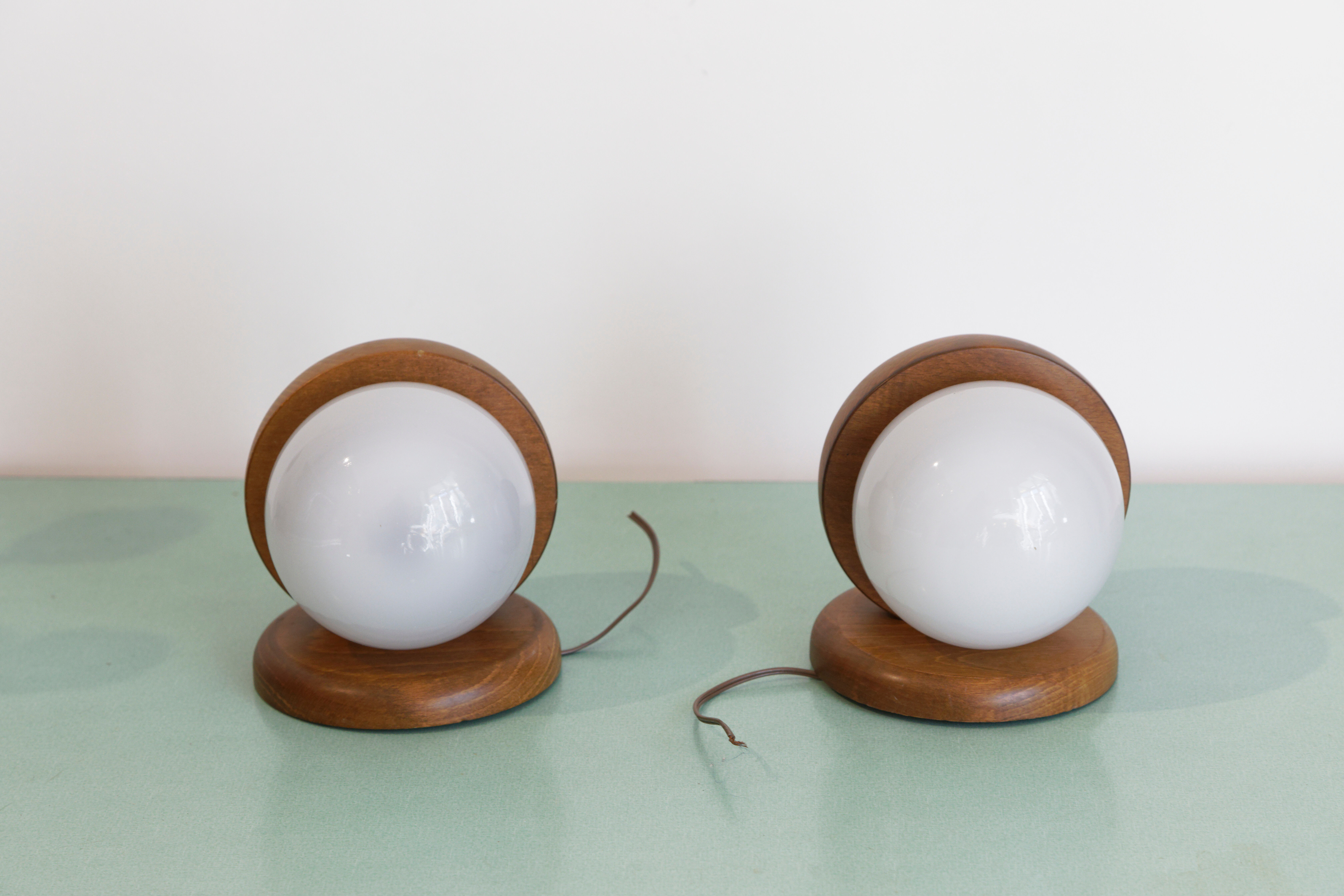 Pair of wood and opal sphere wall lamps