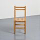 Set of four solid pine chairs by Maison Regain.