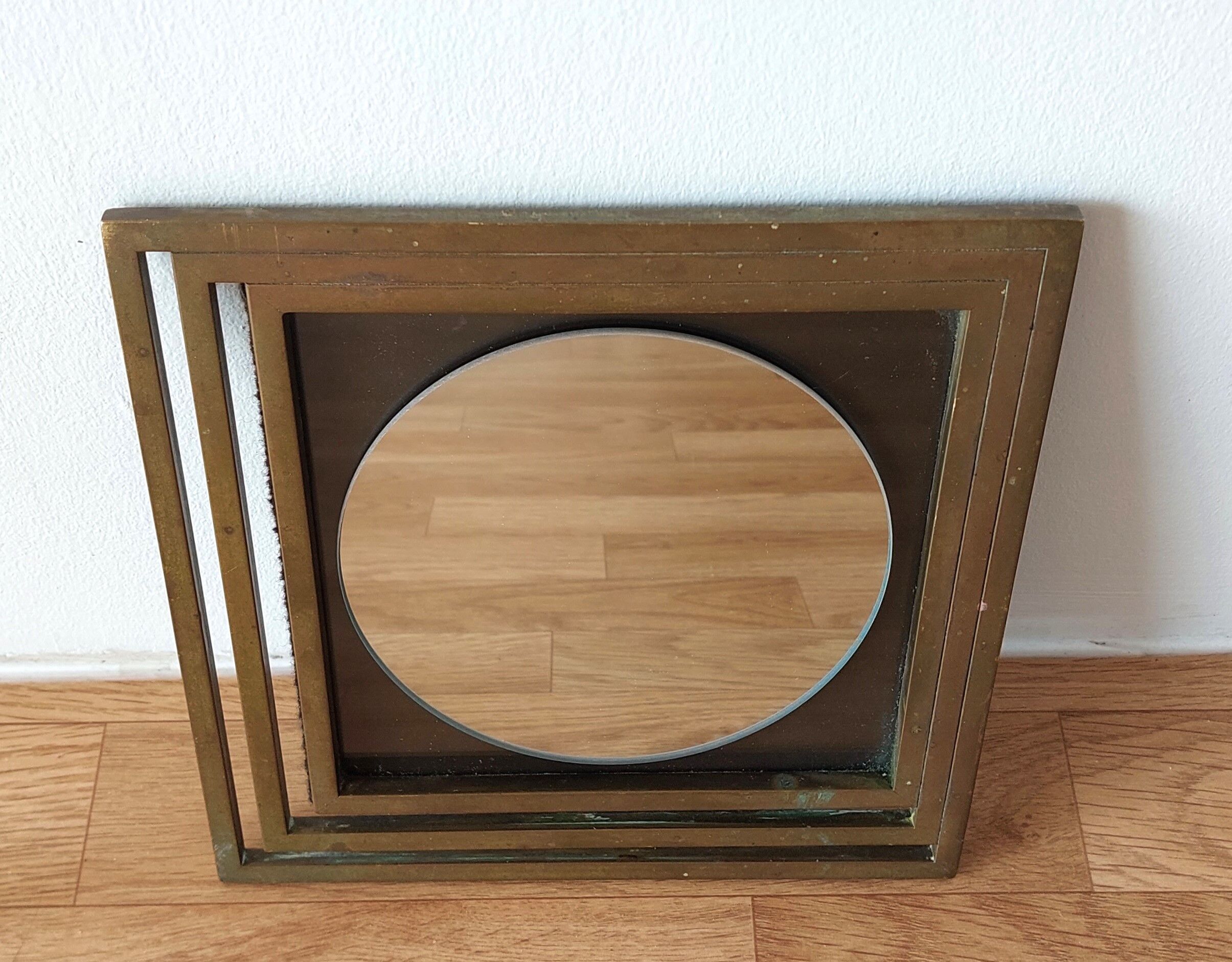 Modernist mirror in gilded brass 1960.