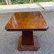 Art Deco dining table in rosewood from the 1950s with a central leg.