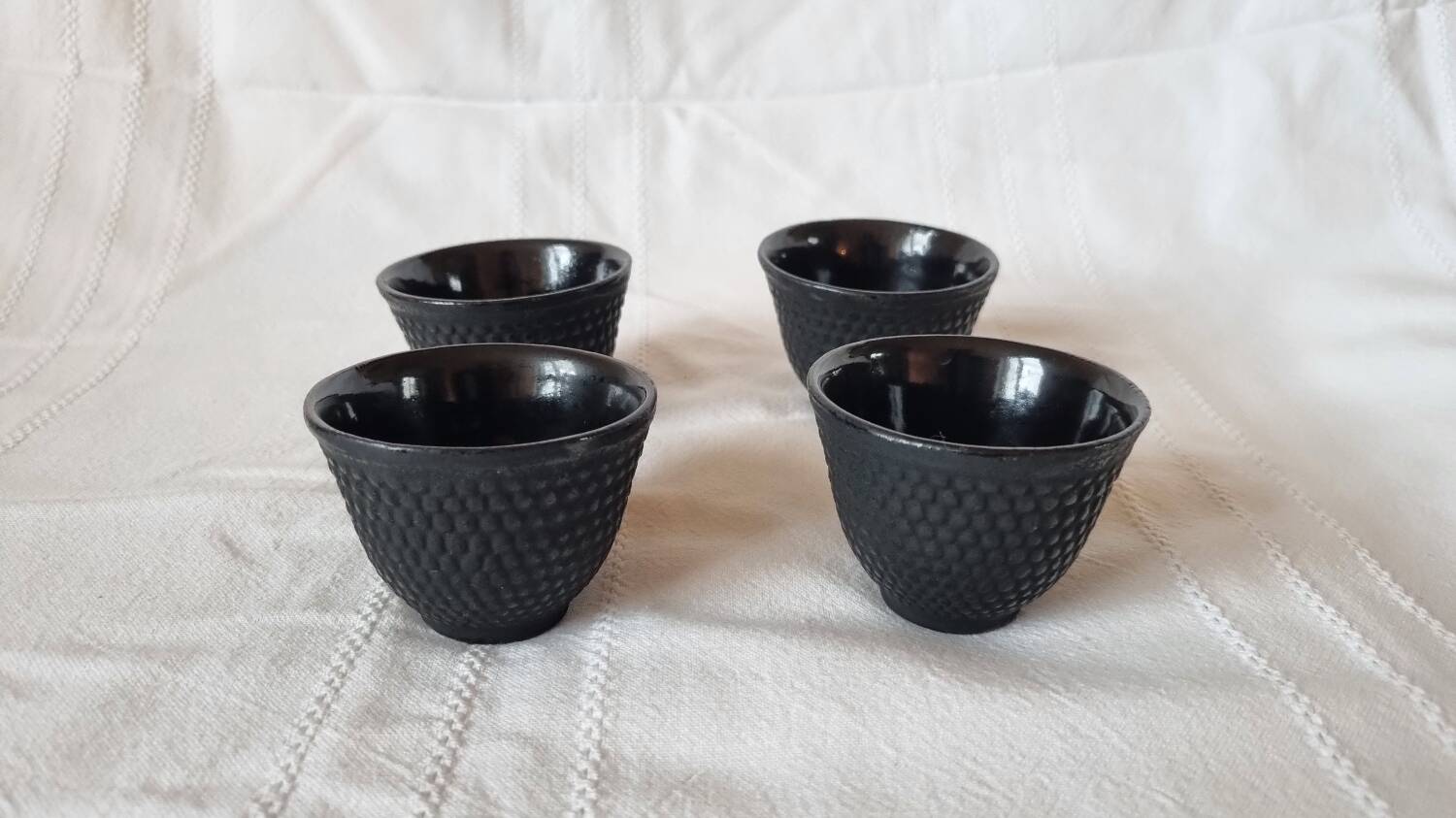 4 black cast iron teacups