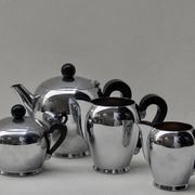 Bombé tea service designed by Carlo Alessi in 1945 for Alfra Italy. Silver stainless steel and black bakélite