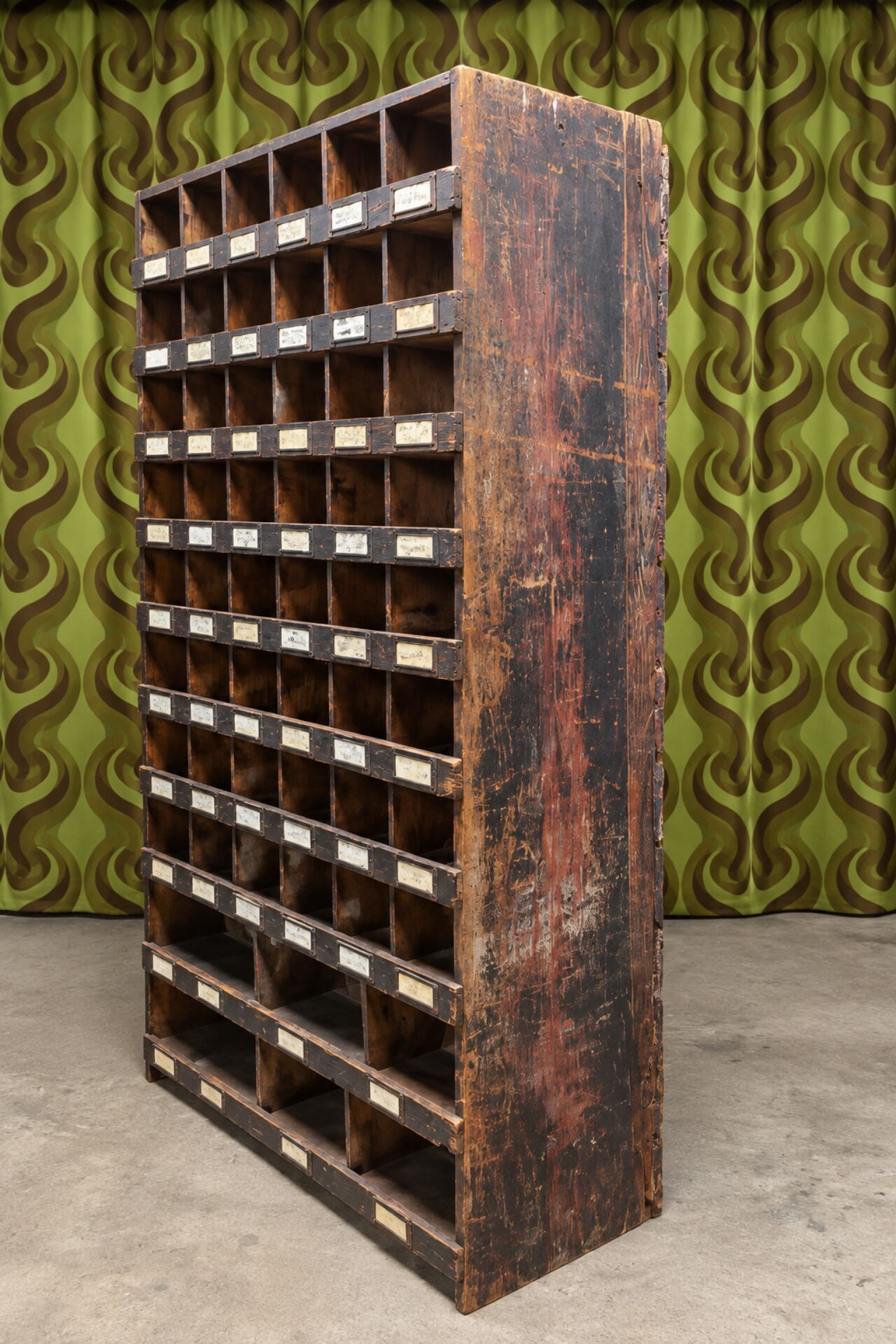 Antique workshop furniture in solid fir with numerous compartments.
