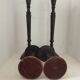 Two pairs of patinated brass candle holders