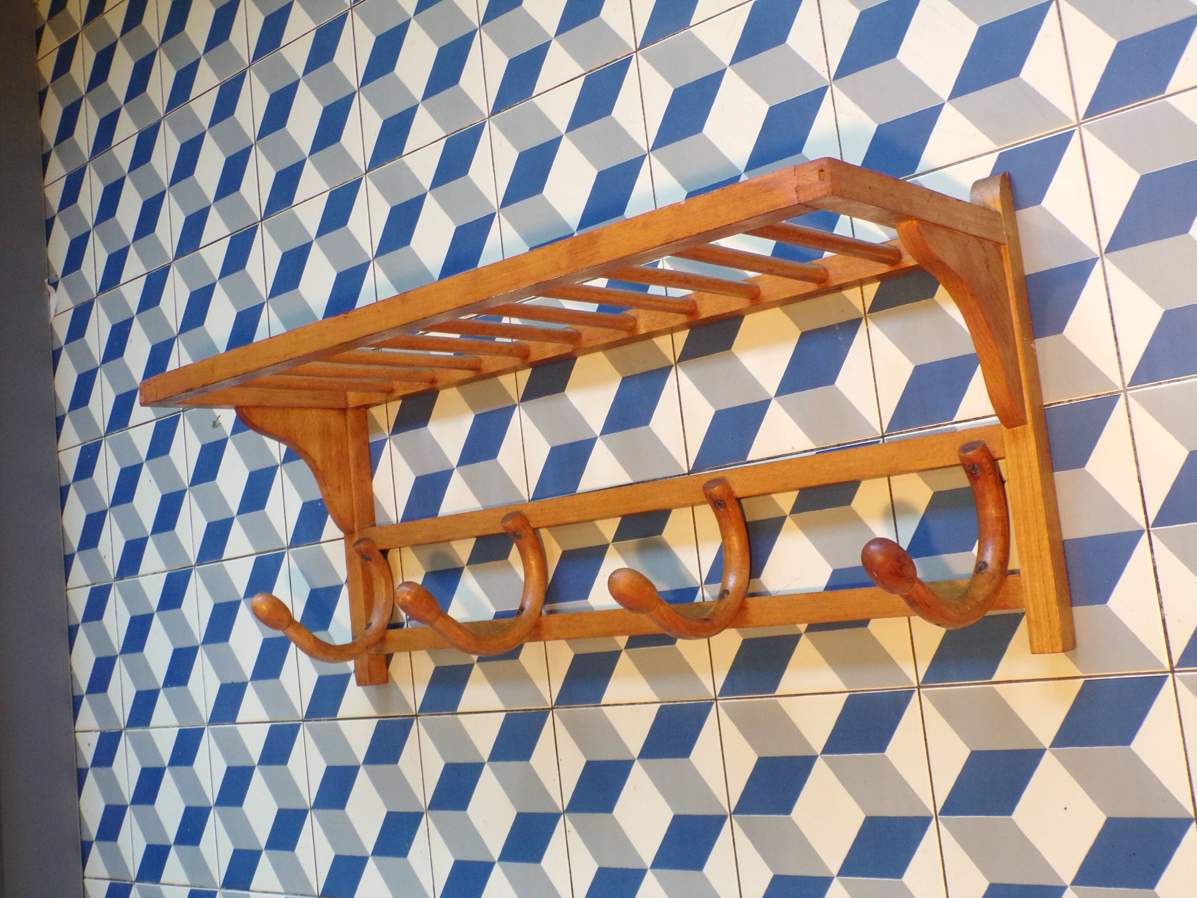 Curved wooden coat rack with shelf