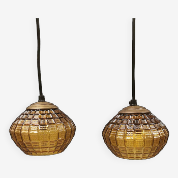 Hanging lamps with a shade of what we can best describe as an amber/olive green glass shade.