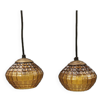 Hanging lamps with a shade of what we can best describe as an amber/olive green glass shade.