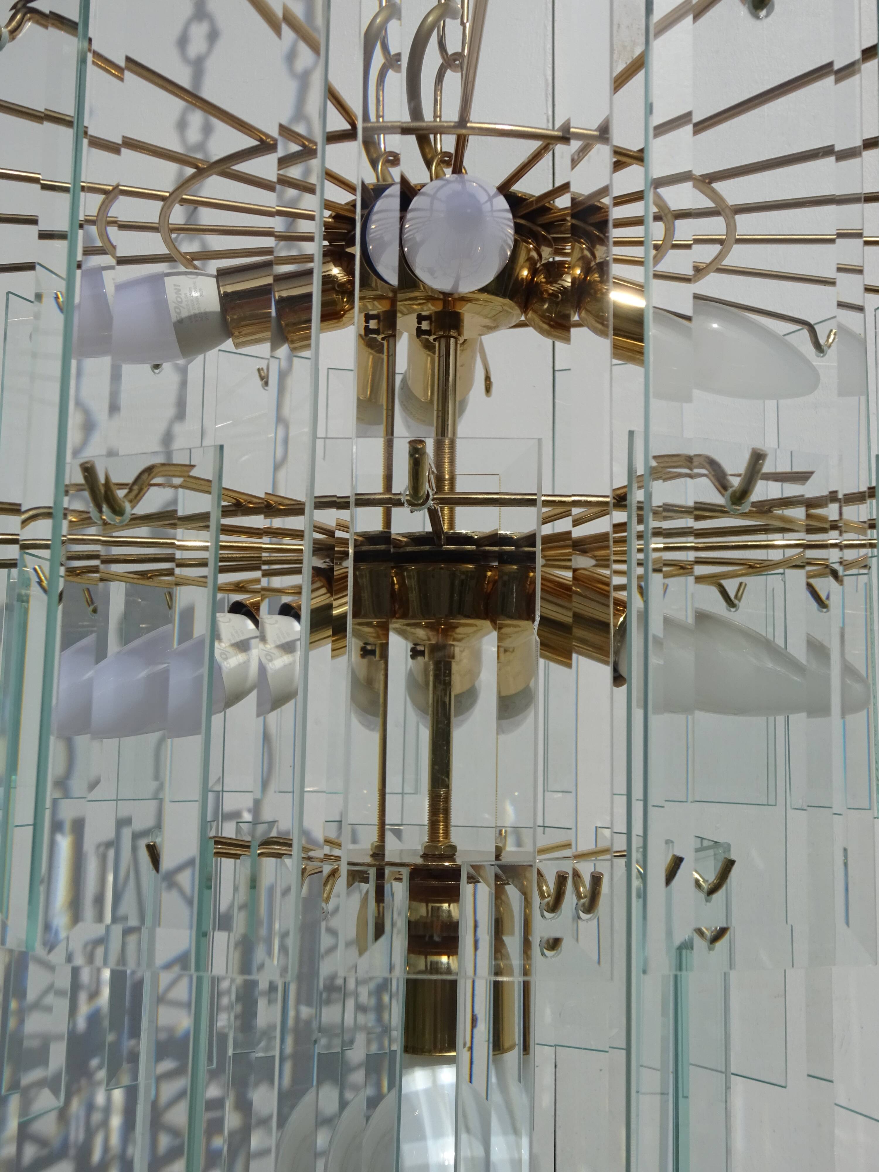 Brass chandelier and beveled glass, Italian manufacturing