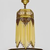 Art Nouveau style bronze chandelier with yellow and mauve pendants, 11 lights. 1960s