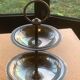 Double cup display in vintage silver metal