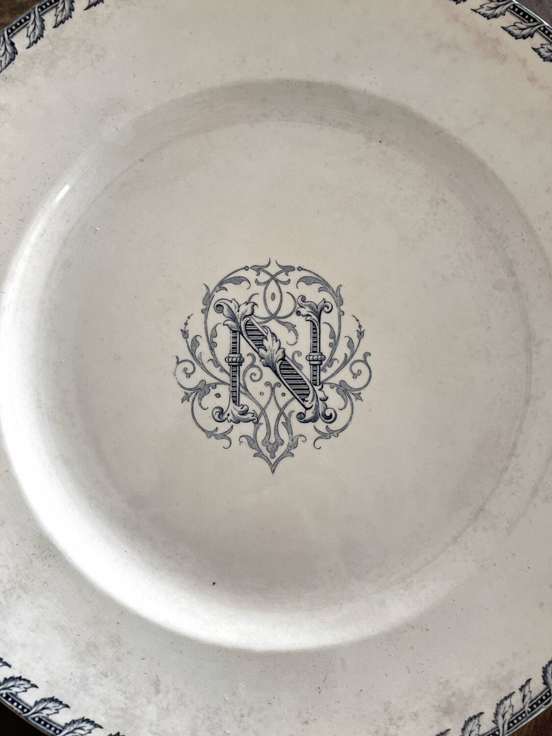 Round iron earth dish monogram “N” KG Lunéville