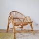 Vintage adult rattan armchair from the 1960s.
