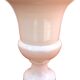 Vase on a pedestal, glazed white ceramic.