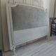 160-style louis XVI style headboard patinated pearl grey waxed finish, lined with grey velvet