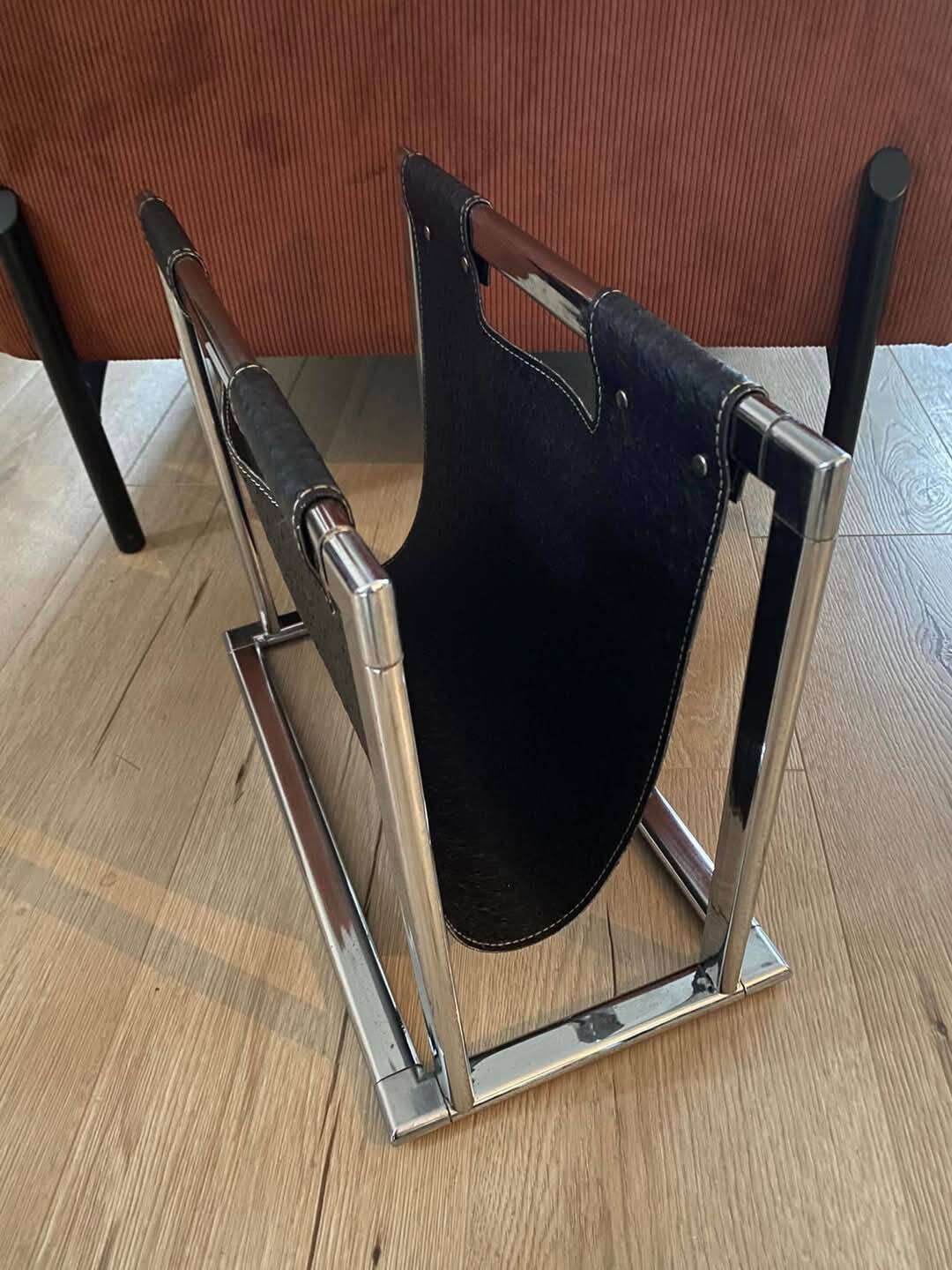 Chrome metal and leather magazine rack