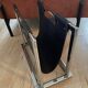 Chrome metal and leather magazine rack