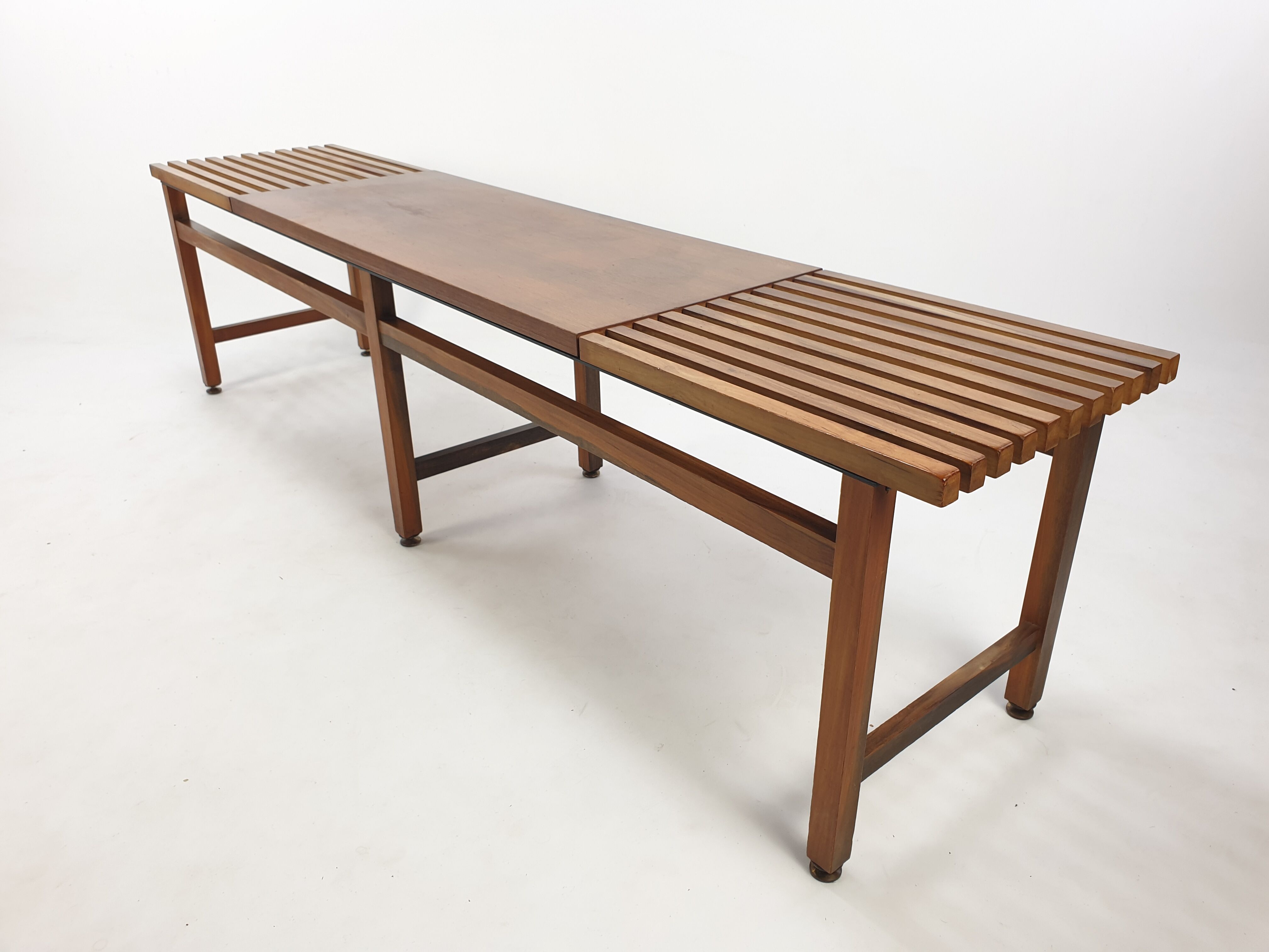Bench in walnut and teak with brass feet, italy 1950s