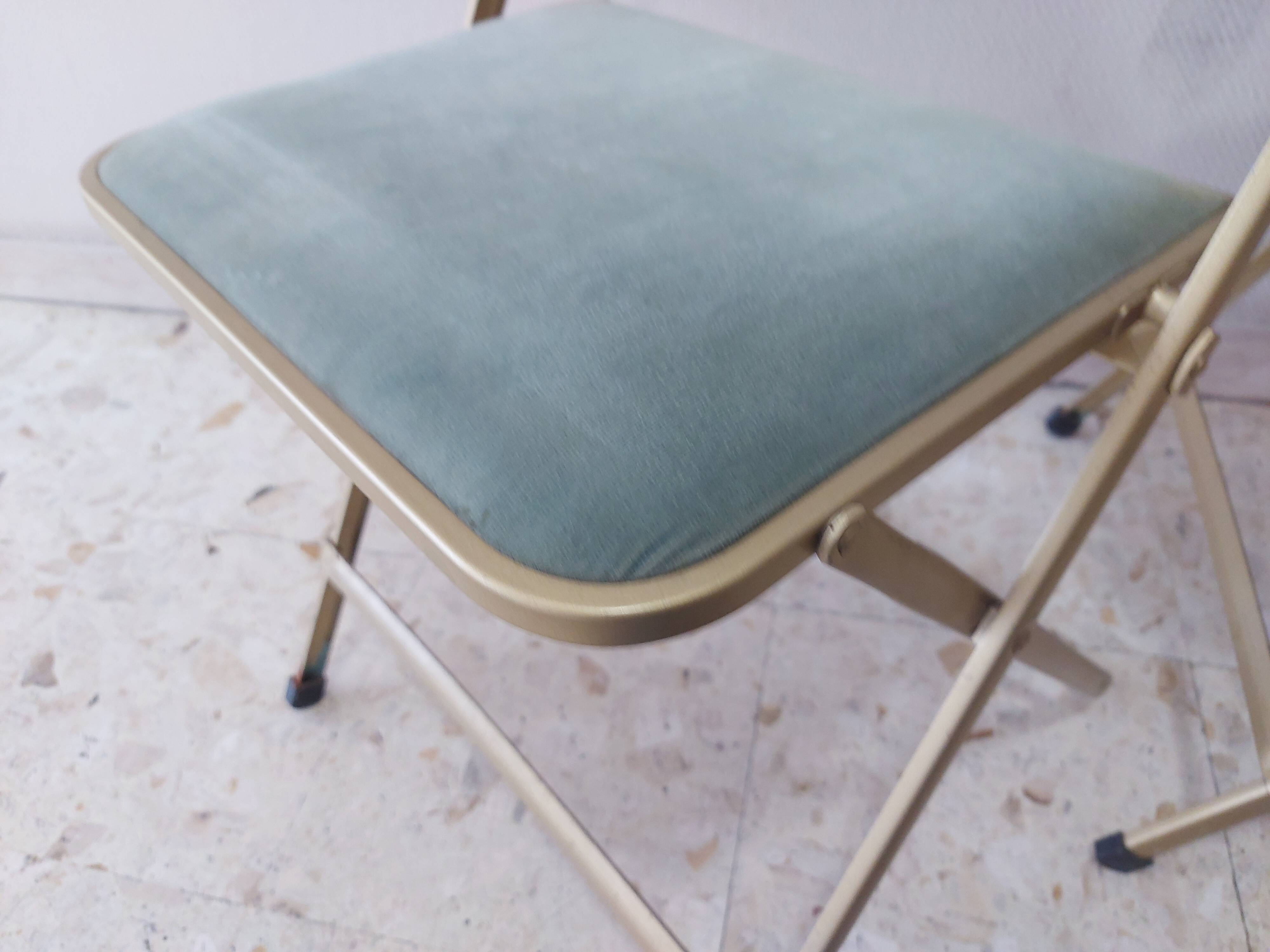 Two folding opera chairs in velvet