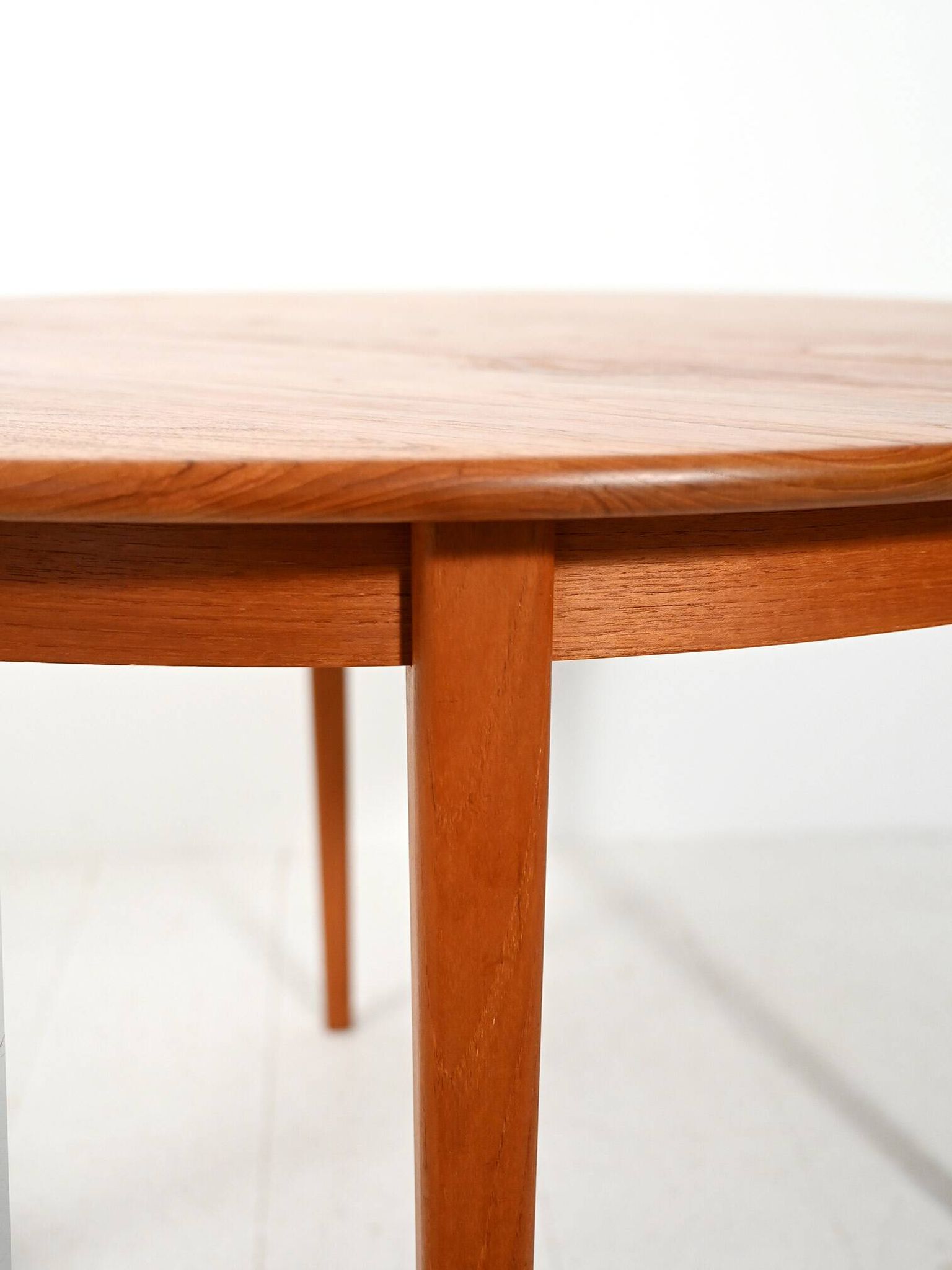 Round extendable teak table by Svante Skogh