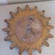 Miroir soleil vintage , en bois doré .