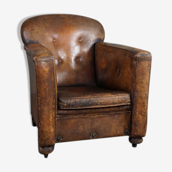 Antique armchair in sheepskin