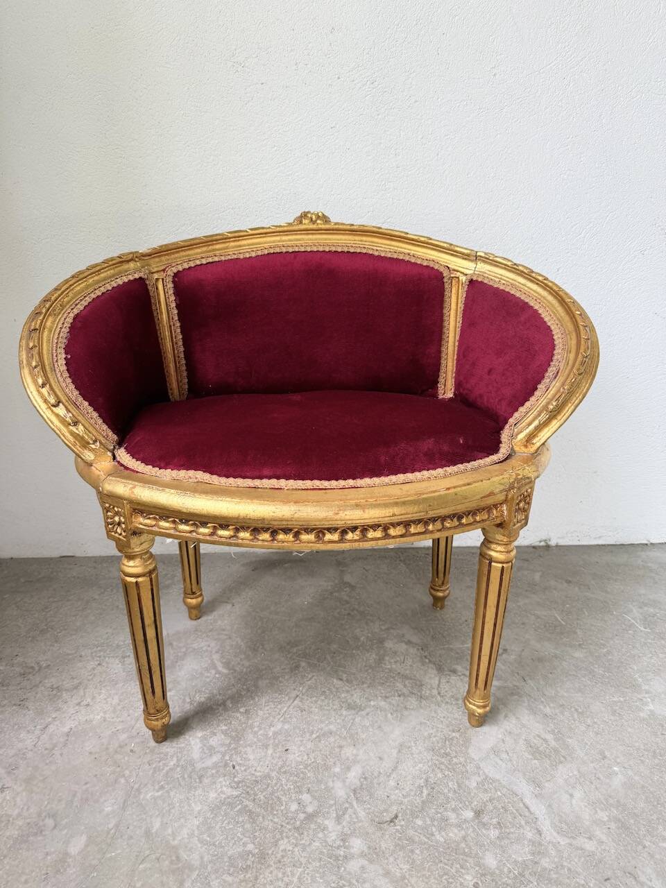 Louis XVI gilt wood and red velvet armchair