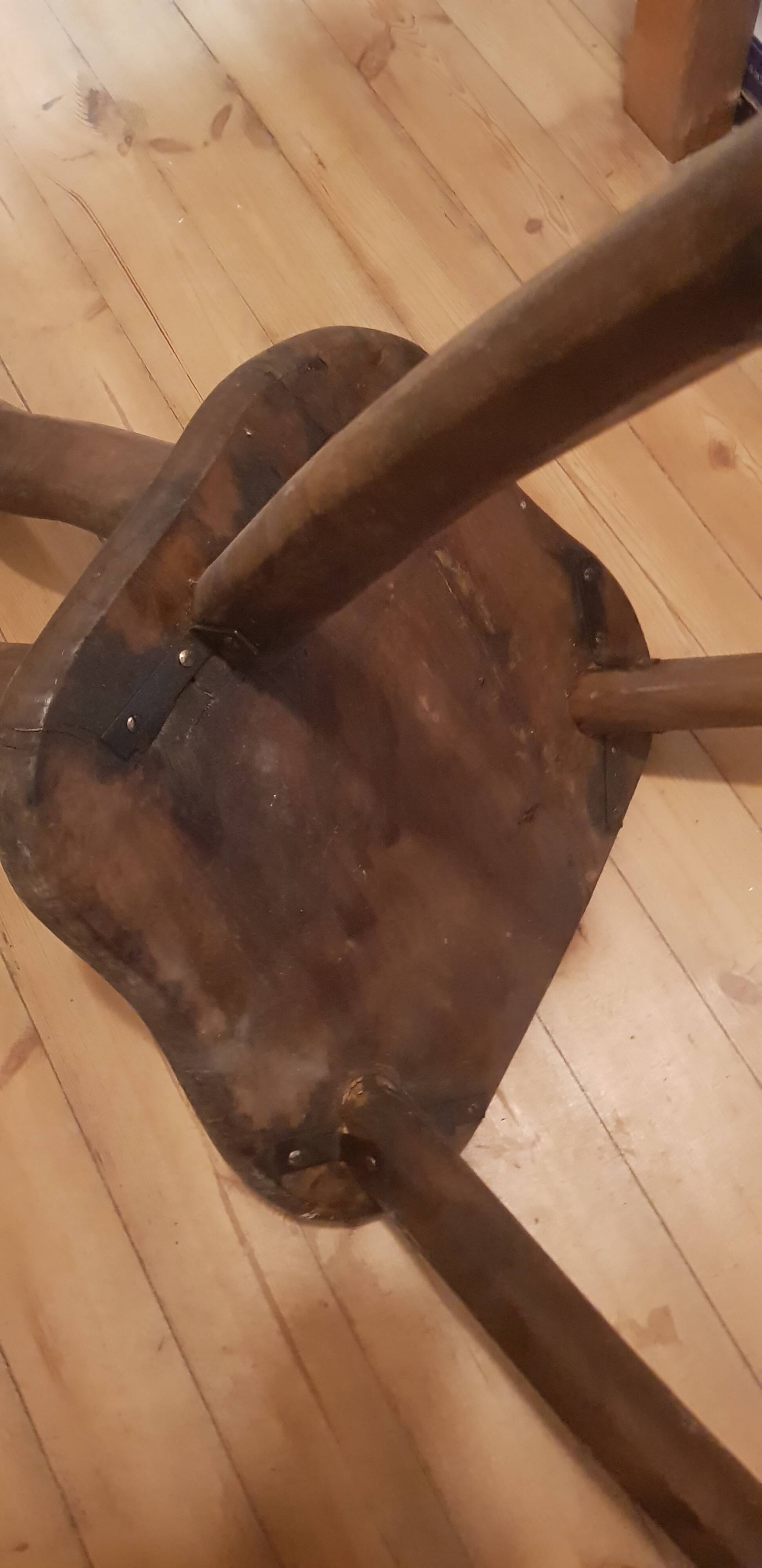 3 brutalist wooden tripod chairs