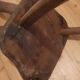 3 brutalist wooden tripod chairs