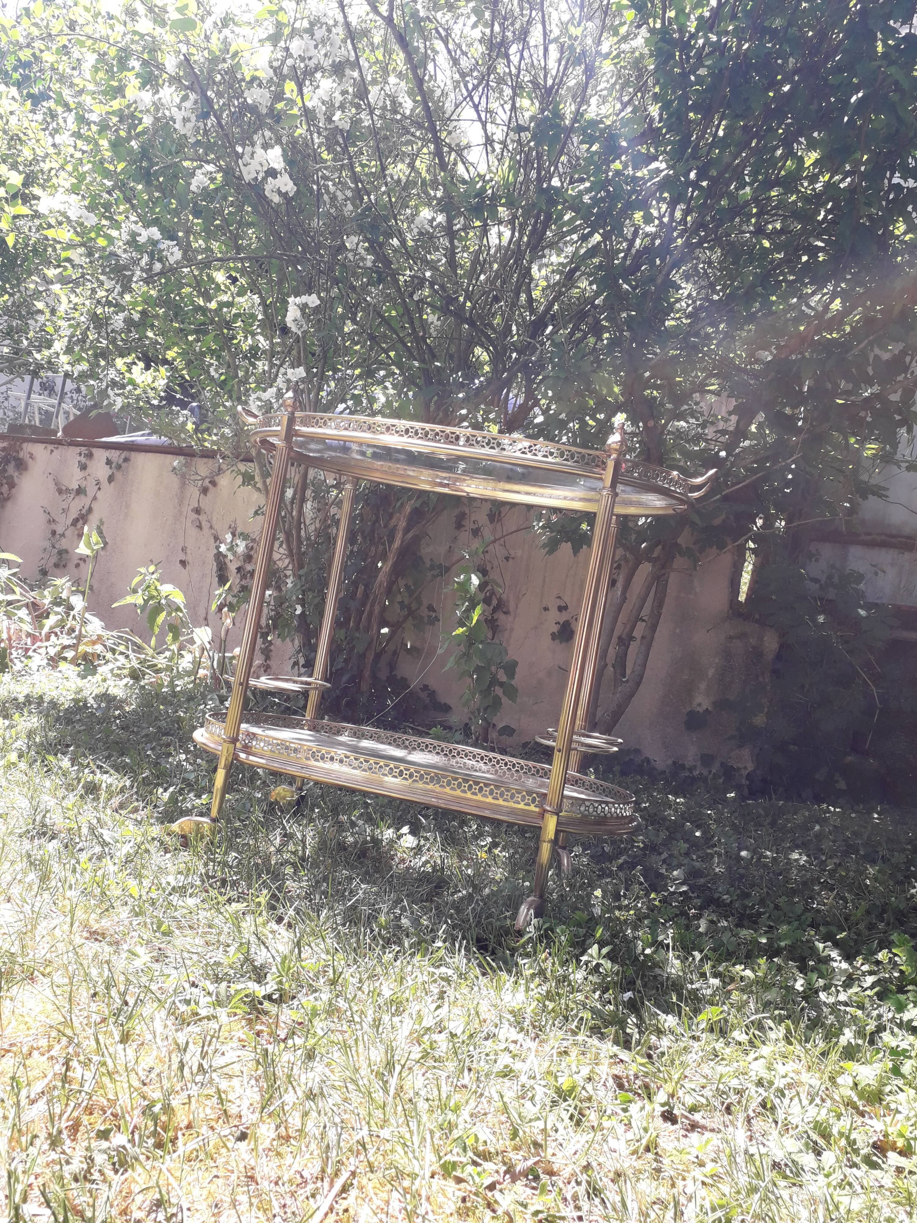 Dessert on brass wheels and glass door bottles year 60