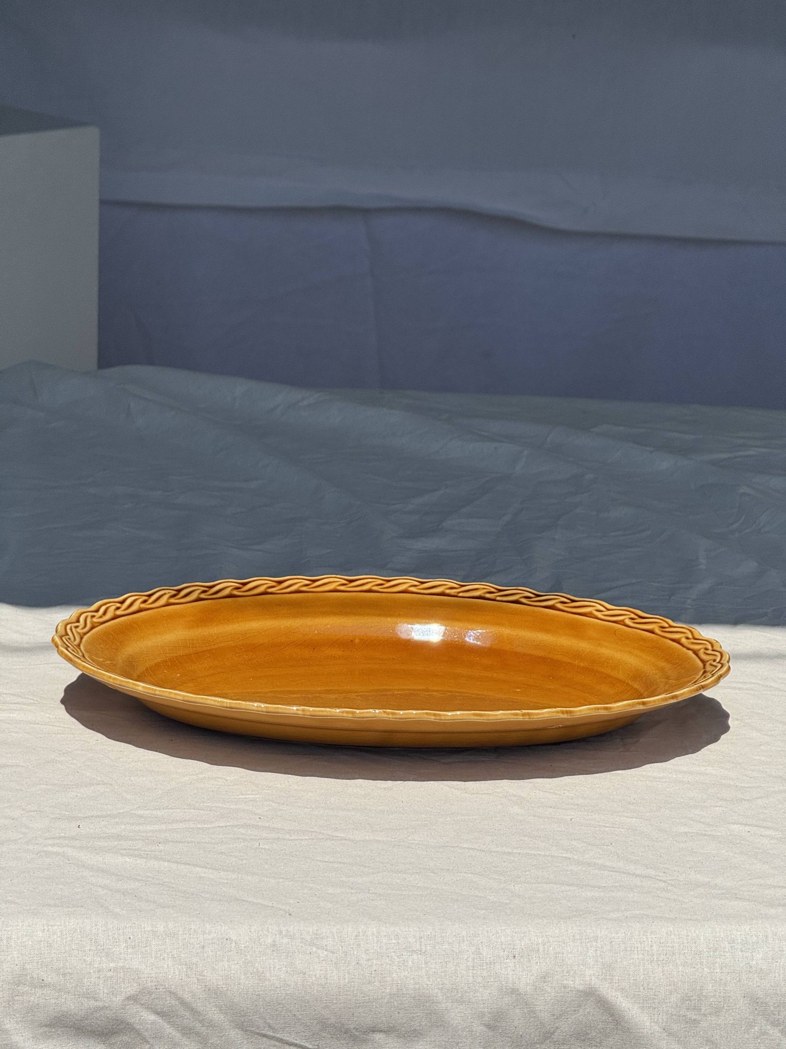Antique oval dish, yellow-orange, frieze border L:24