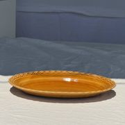 Antique oval dish, yellow-orange, frieze border L:24
