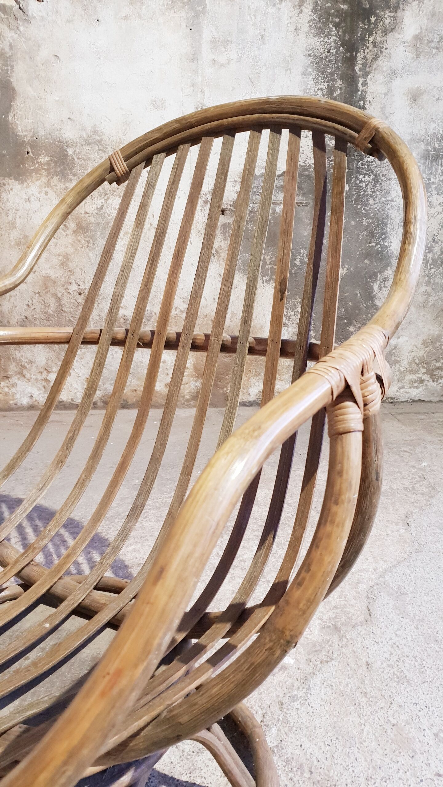 Antique swivel rattan armchair