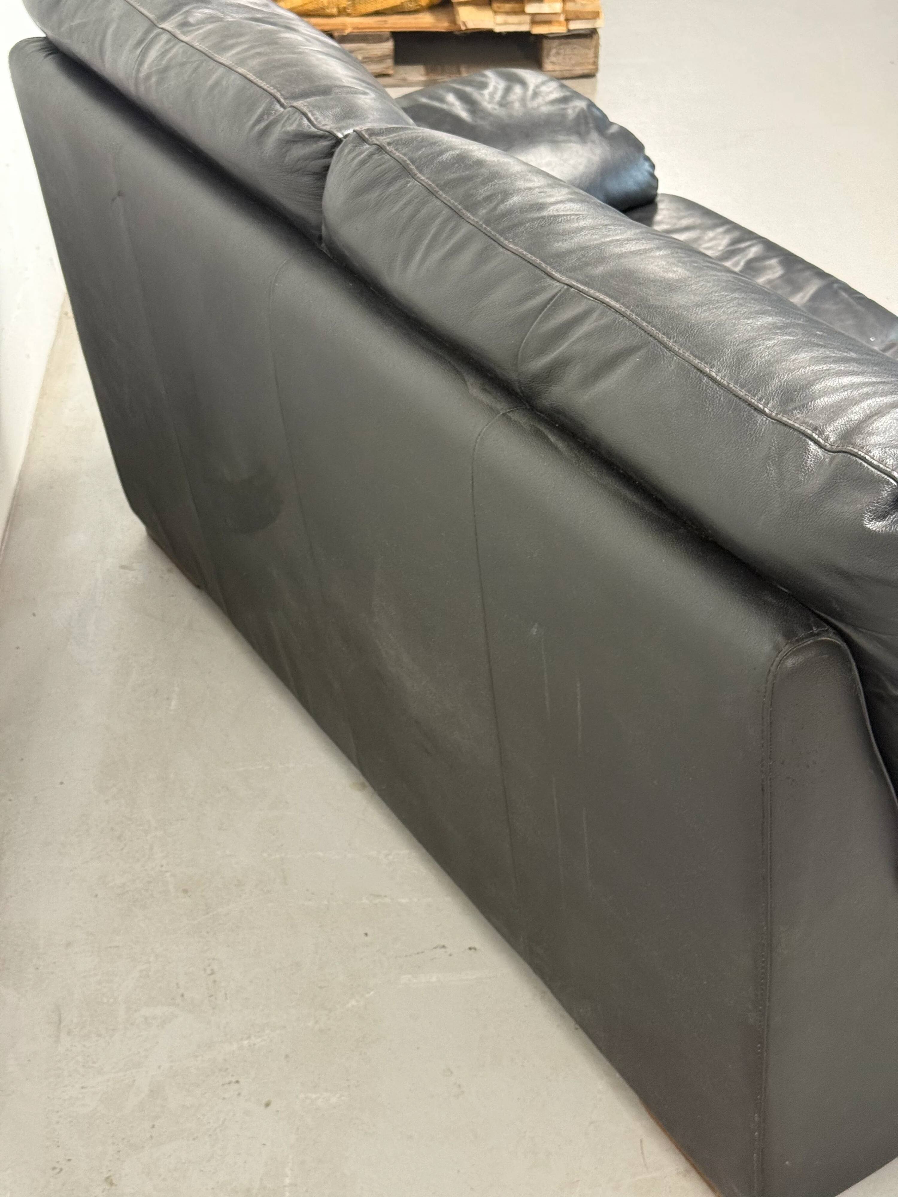 Two-seater black leather sofa — Italian postmodern design