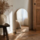 Contemporary Scandinavian mirror in gold metal with rounded corners.