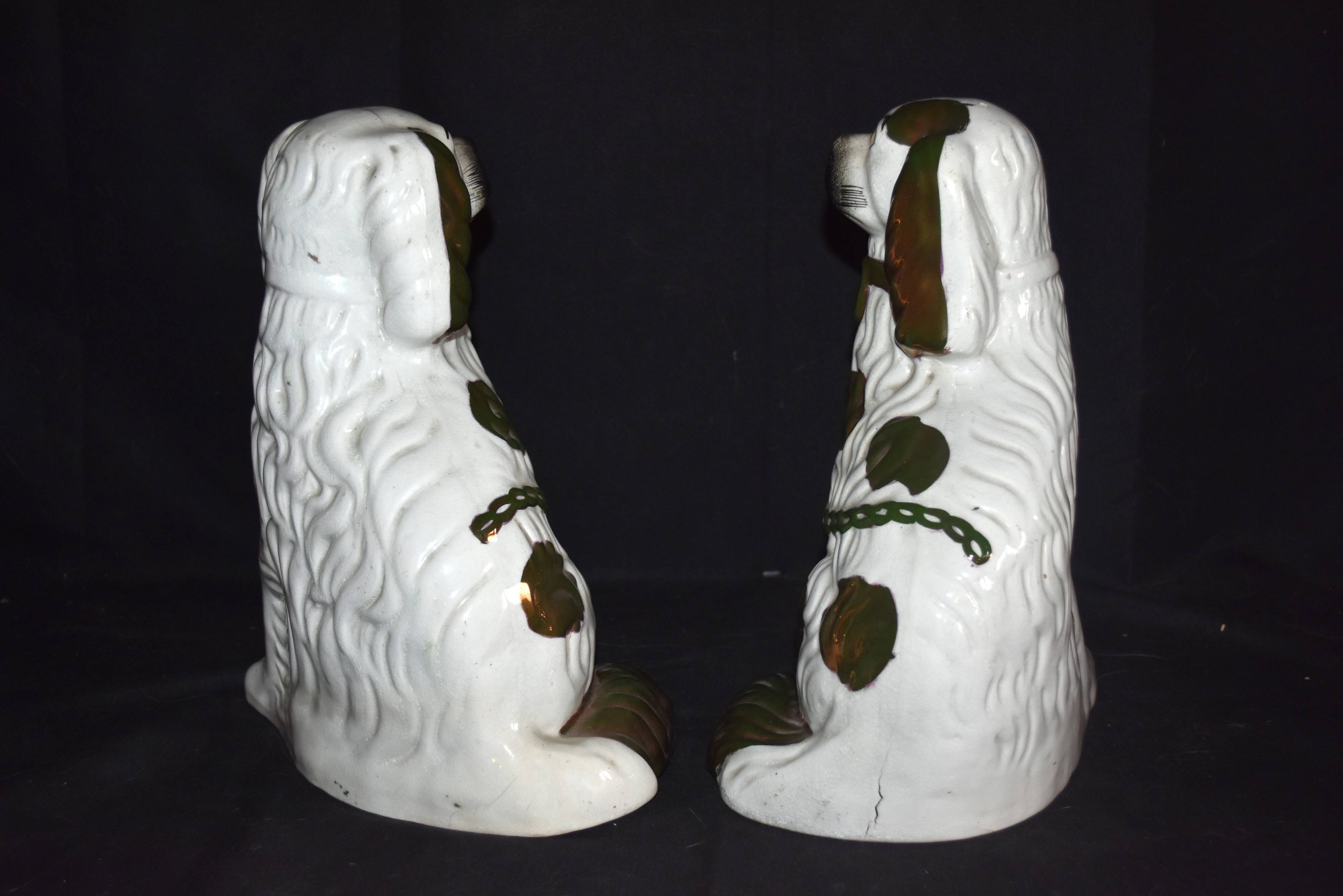 Pair of earthenware dogs (cavalier king charles)