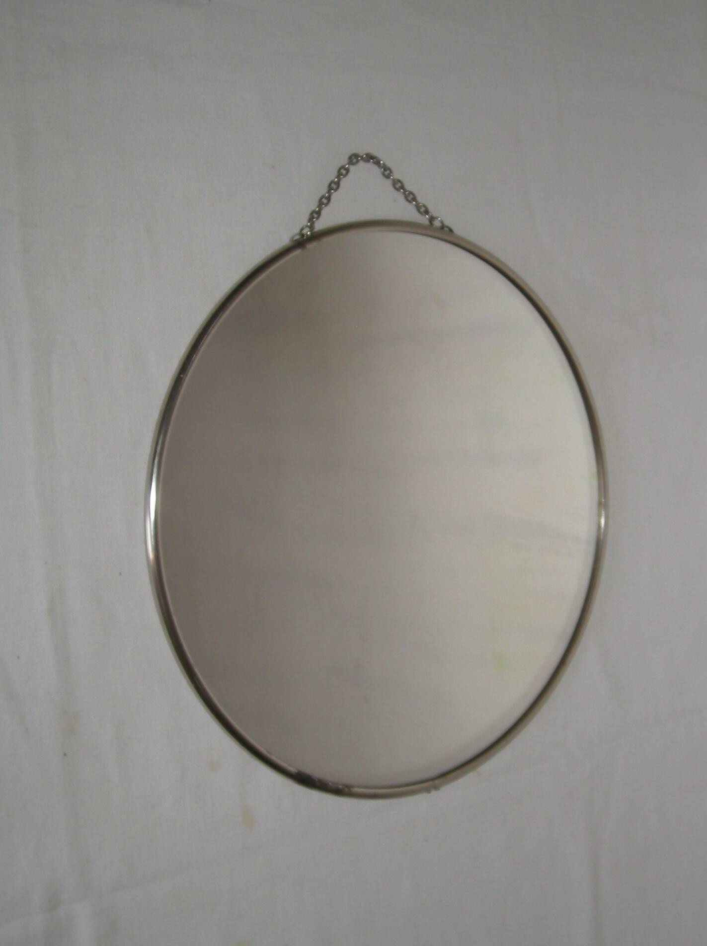 Round barber mirror with chain from the 1950s.