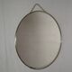 Round barber mirror with chain from the 1950s.