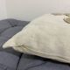 Cushion in vintage fabric with ornamentation.
