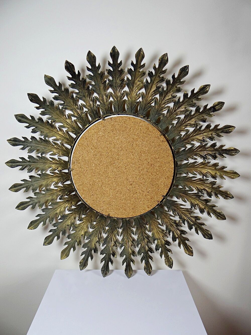 Large Italian sunburst wall mirror in gilded metal, 1960s-70s.